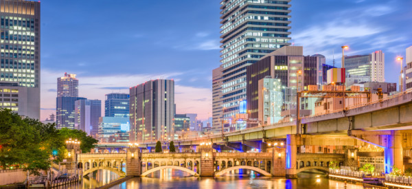 Osaka, Japan downtown cityscape on the river.