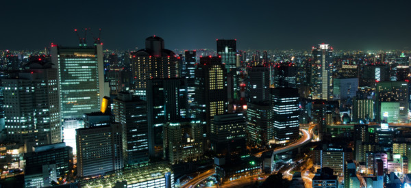 Panorama skyline of Osaka City in Japan at night with lots of lights