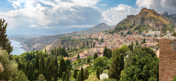 Panoramic view of Taormina with Giardini Naxox town in the backgroind, Sicily, Italy