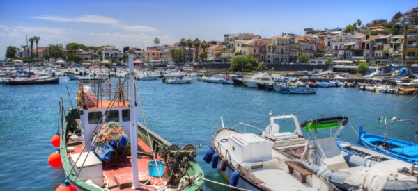 Summer view of the Port of Aci Trezza in Sicily Italy