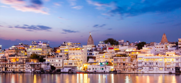 Evening view of  illuminated houses on lake Pichola in twilight, Udaipur, Rajasthan, India